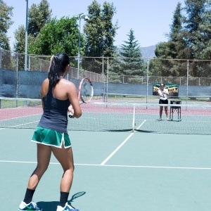 Andrea Madrigal Playing Tennis Against Yoland Duron
